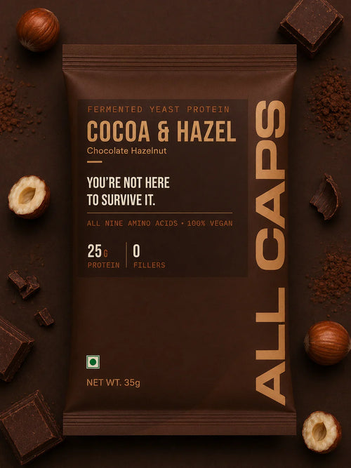 Cocoa & Hazelnut protein bar with 25g protein, vegan, no fillers, surrounded by chocolate and hazelnuts